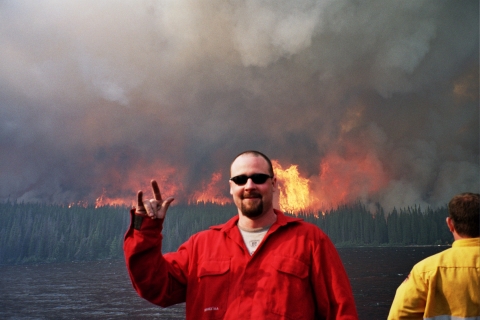 Firestorm Team posing behind fire